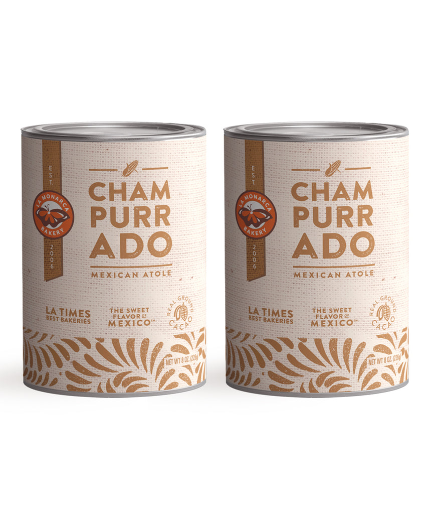 Two tins of Champurrado Mix